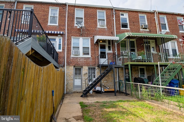 1323 W 41st St, Baltimore, MD 21211 - rear view of property with stairway, brick siding, and stone siding