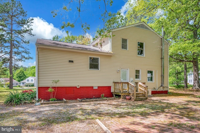 back of property with crawl space