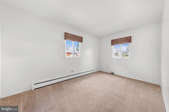 14B Heron St S, Manchester Township, NJ 08759 - spare room featuring baseboards, carpet flooring, a baseboard heating unit, and a wealth of natural light