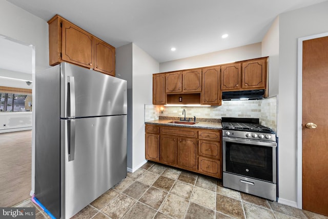 14B Heron St S, Manchester Township, NJ 08759 - kitchen with extractor fan, appliances with stainless steel finishes, decorative backsplash, and a sink