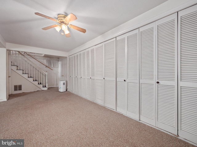 59 Hagan Dr, New Hope, PA 18938 - interior space featuring visible vents, a ceiling fan, carpet flooring, and stairs