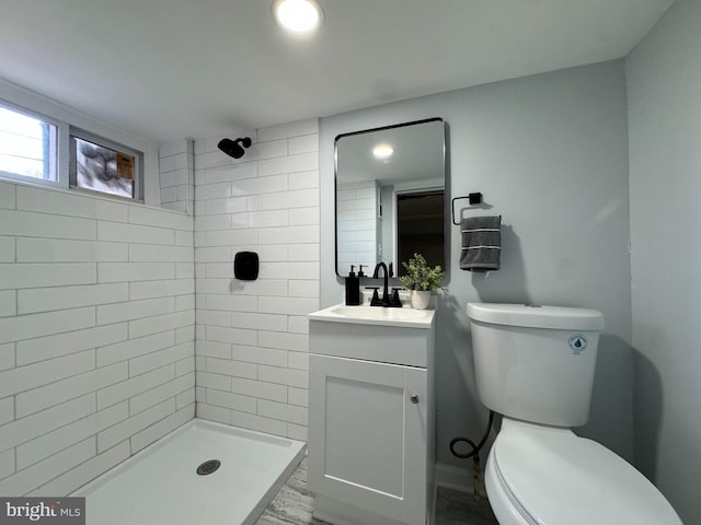 full bath featuring vanity, toilet, recessed lighting, wood finished floors, and tiled shower