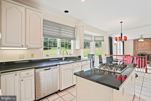 8233 Gallery Ct, Gaithersburg, MD 20886 - kitchen with appliances with stainless steel finishes, a sink, light tile patterned floors, dark countertops, and recessed lighting
