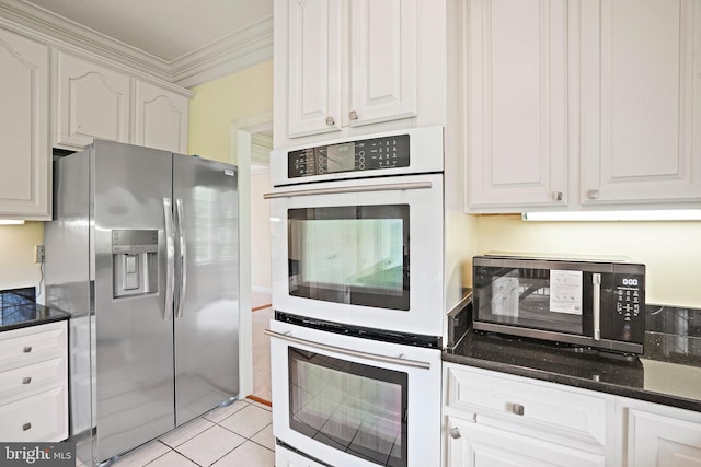8233 Gallery Ct, Gaithersburg, MD 20886 - kitchen with appliances with stainless steel finishes, crown molding, white cabinets, and light tile patterned flooring