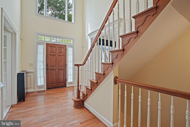 8233 Gallery Ct, Gaithersburg, MD 20886 - entryway featuring a high ceiling, hardwood / wood-style flooring, and stairs