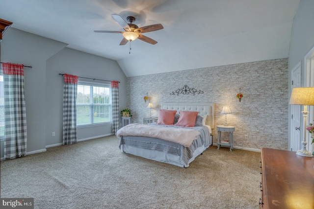 bedroom with baseboards, carpet flooring, ceiling fan, and lofted ceiling