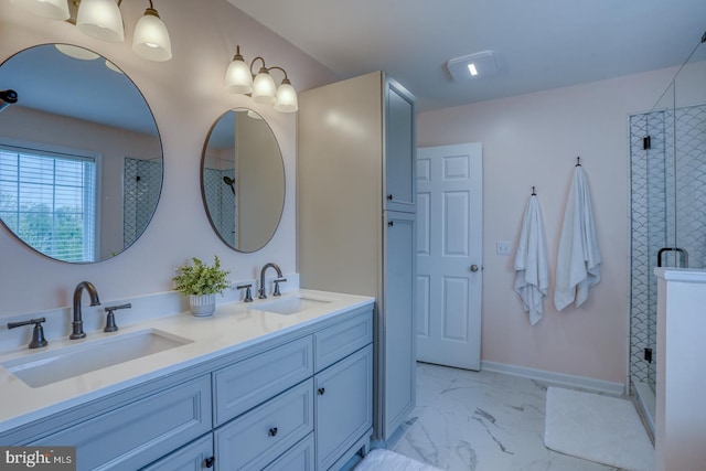 bathroom featuring a sink, double vanity, marble finish floor, and a stall shower