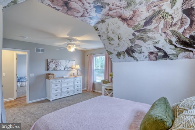 bedroom featuring carpet flooring, visible vents, baseboards, and a ceiling fan
