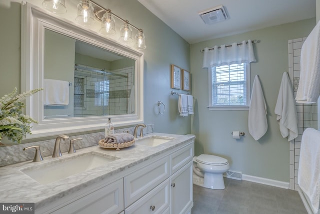 full bathroom featuring a shower stall, tile patterned floors, a sink, and visible vents