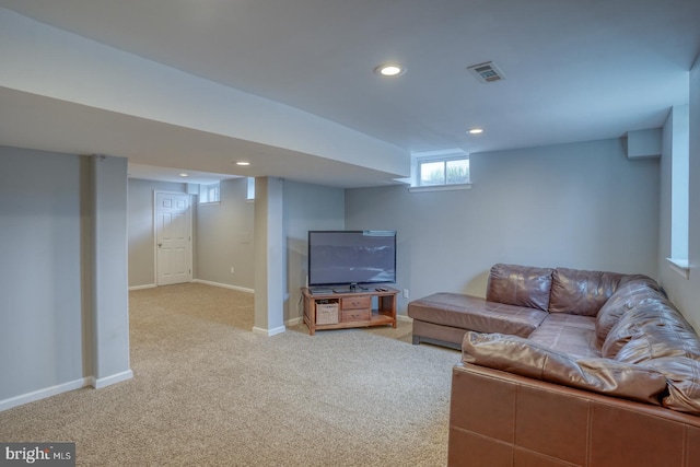 living room with light carpet, recessed lighting, visible vents, and baseboards