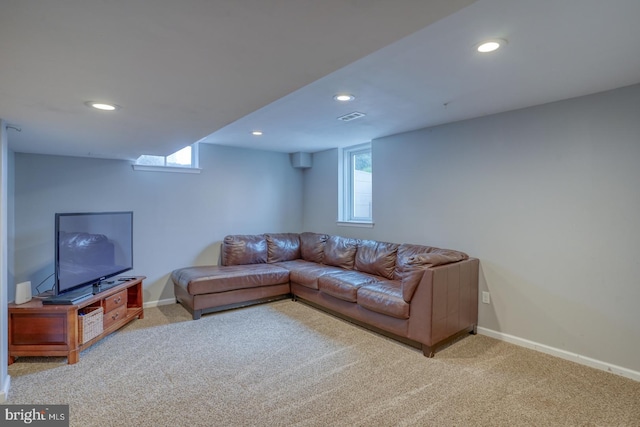 carpeted living room featuring recessed lighting and baseboards