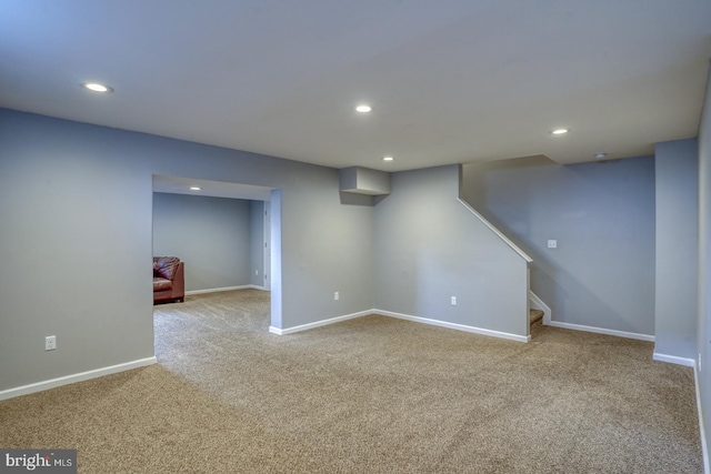 finished basement with recessed lighting, carpet, baseboards, and stairs