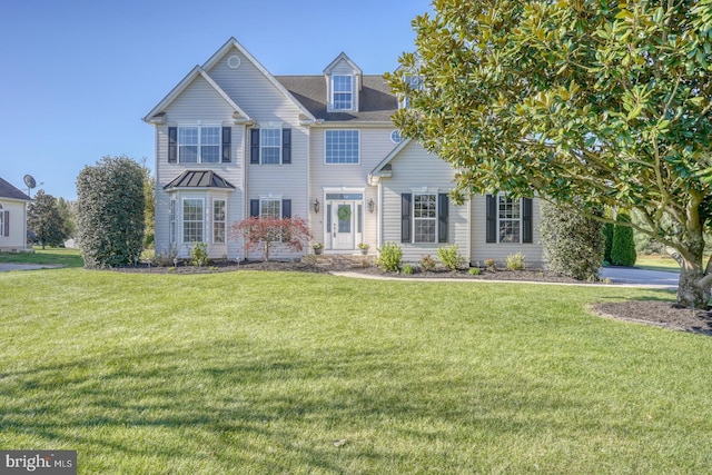 view of front facade featuring a front yard
