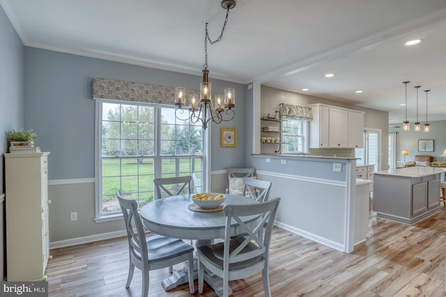 dining area featuring baseboards, a notable chandelier, ornamental molding, recessed lighting, and light wood-style flooring