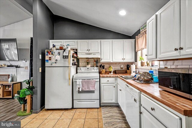 7443 Tamara Ln, Tobyhanna, PA 18466 - kitchen featuring white cabinets, white appliances, vaulted ceiling, and under cabinet range hood