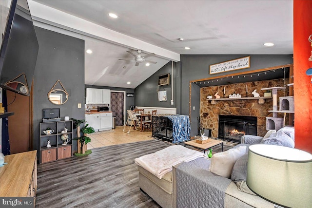 7443 Tamara Ln, Tobyhanna, PA 18466 - living area featuring a fireplace, lofted ceiling with beams, a ceiling fan, recessed lighting, and wood finished floors