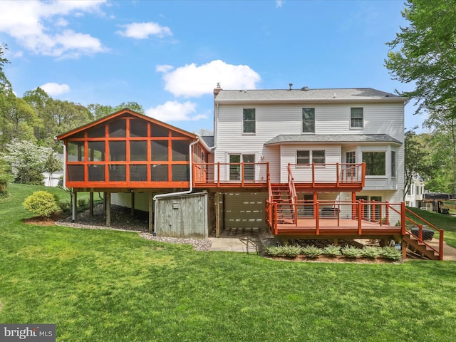 back of house with a chimney, a deck, stairs, and a lawn