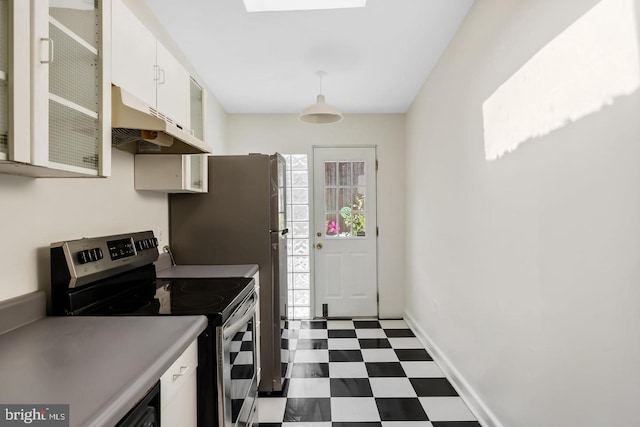 kitchen featuring glass insert cabinets, dark floors, white cabinetry, stainless steel range with electric stovetop, and under cabinet range hood