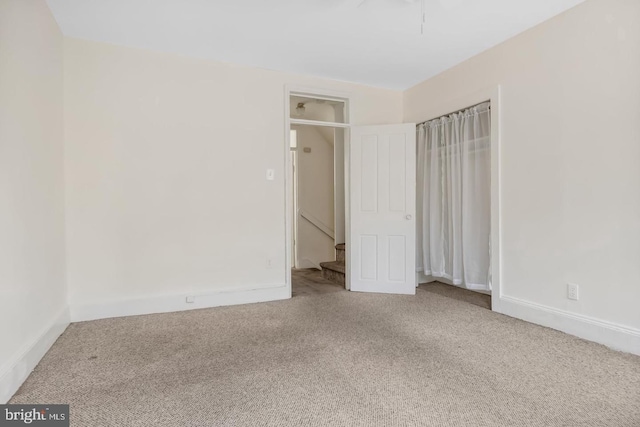 unfurnished bedroom featuring carpet