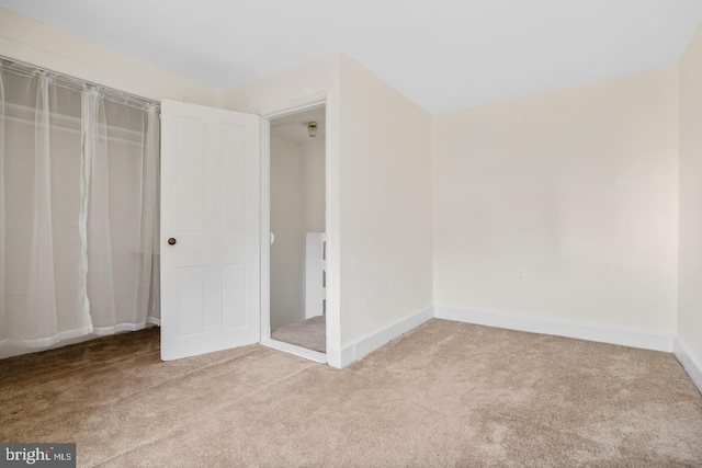 unfurnished bedroom with carpet and baseboards