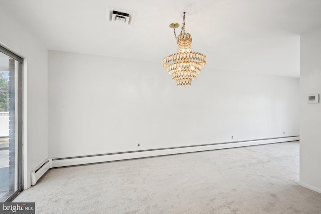 carpeted spare room with a baseboard heating unit, visible vents, and a chandelier