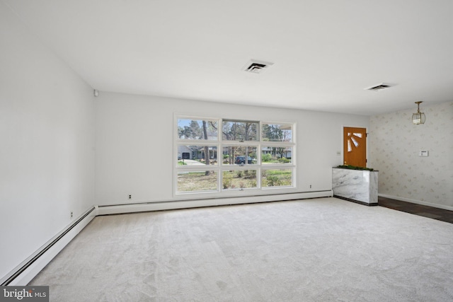 unfurnished living room with baseboards, carpet, visible vents, and baseboard heating