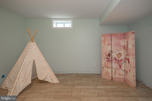rec room featuring wood finished floors
