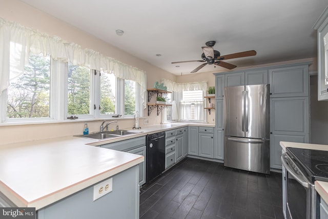 kitchen featuring open shelves, a sink, ceiling fan, appliances with stainless steel finishes, and gray cabinets