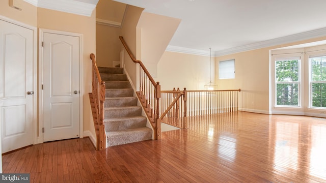 2080 Capstone Cir, Herndon, VA 20170 - staircase with hardwood / wood-style floors, baseboards, and crown molding