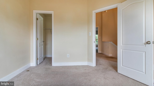 2080 Capstone Cir, Herndon, VA 20170 - unfurnished bedroom featuring carpet flooring, a walk in closet, baseboards, and a closet