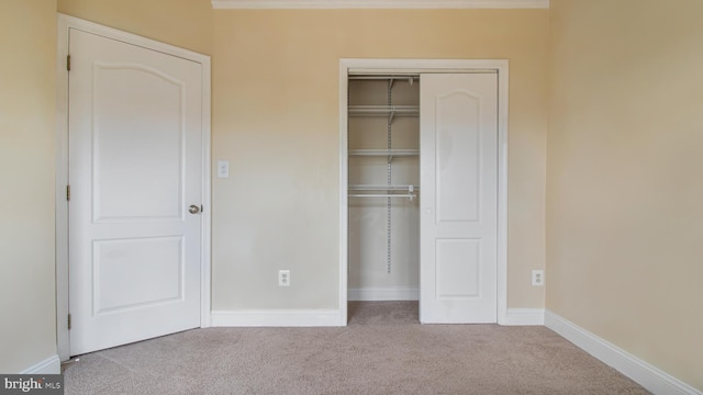 2080 Capstone Cir, Herndon, VA 20170 - unfurnished bedroom featuring carpet, a closet, and baseboards