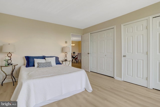 bedroom featuring baseboards and wood finished floors