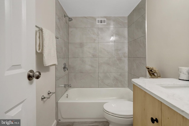 full bath with toilet, shower / washtub combination, visible vents, and vanity