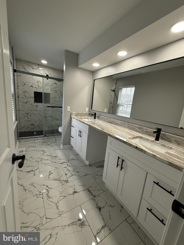 full bath featuring toilet, recessed lighting, vanity, a marble finish shower, and marble finish floor