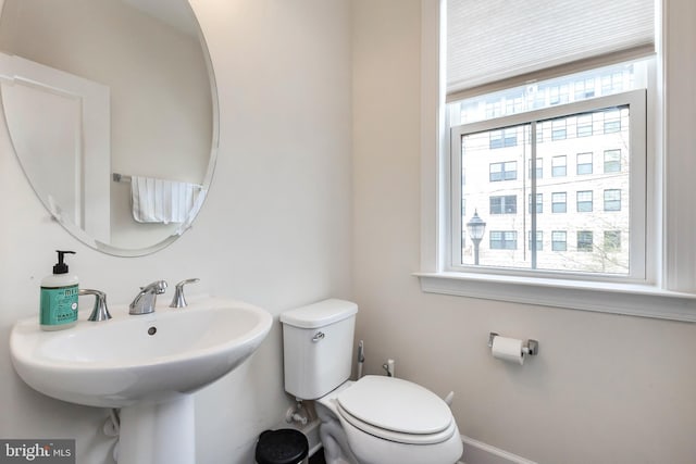 6645 Rhode Island Ave, Riverdale, MD 20737 - half bathroom with a sink, a wealth of natural light, and toilet