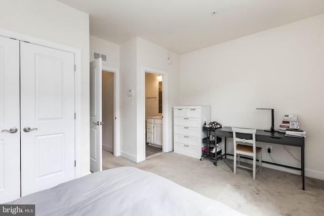 6645 Rhode Island Ave, Riverdale, MD 20737 - bedroom featuring baseboards, ensuite bathroom, visible vents, and light colored carpet
