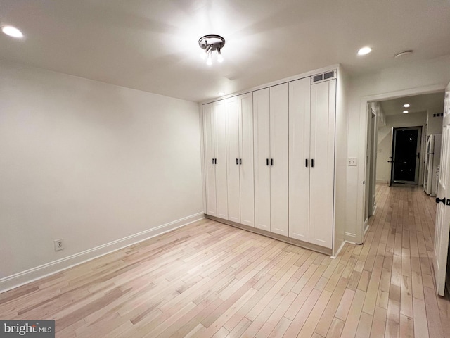 1447 Holbrook St NE, Washington, DC 20002 - unfurnished bedroom with light wood-type flooring, recessed lighting, baseboards, and a closet