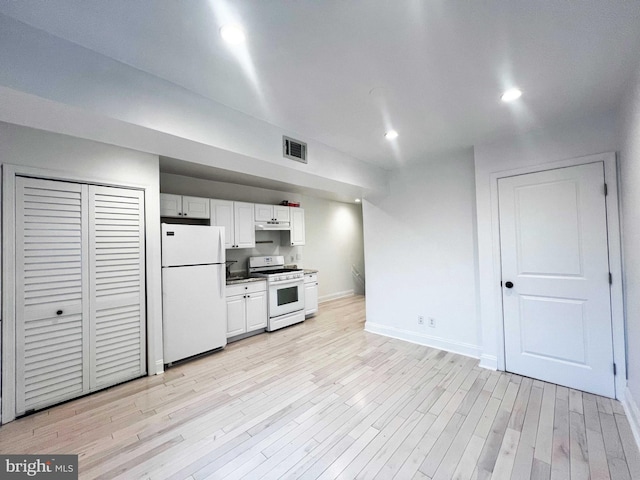 1447 Holbrook St NE, Washington, DC 20002 - kitchen featuring white appliances, baseboards, light wood-type flooring, white cabinets, and a sink