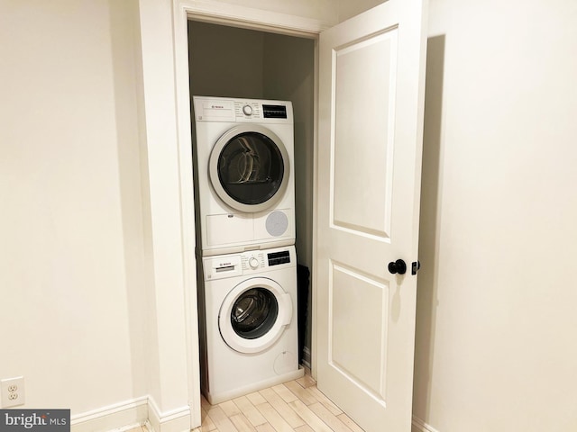 1447 Holbrook St NE, Washington, DC 20002 - laundry room featuring stacked washer / dryer, baseboards, and light wood-style flooring