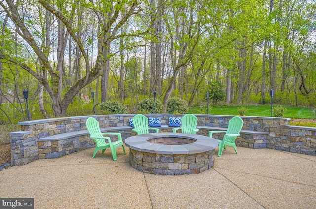 view of patio / terrace with an outdoor fire pit