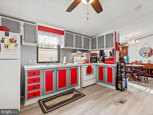 27689 Hartford Ct, Millsboro, DE 19966 - kitchen with light countertops, visible vents, a sink, and white appliances