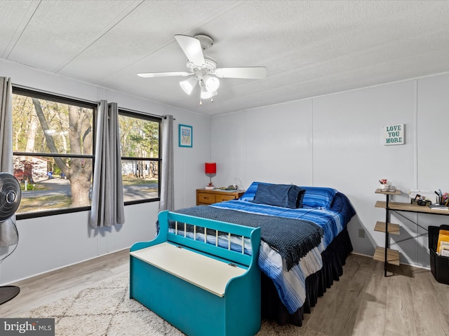 27689 Hartford Ct, Millsboro, DE 19966 - bedroom with a ceiling fan, wood finished floors, and a textured ceiling
