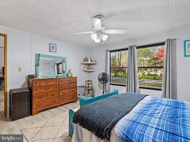 27689 Hartford Ct, Millsboro, DE 19966 - bedroom featuring wood finished floors, a textured ceiling, and ceiling fan