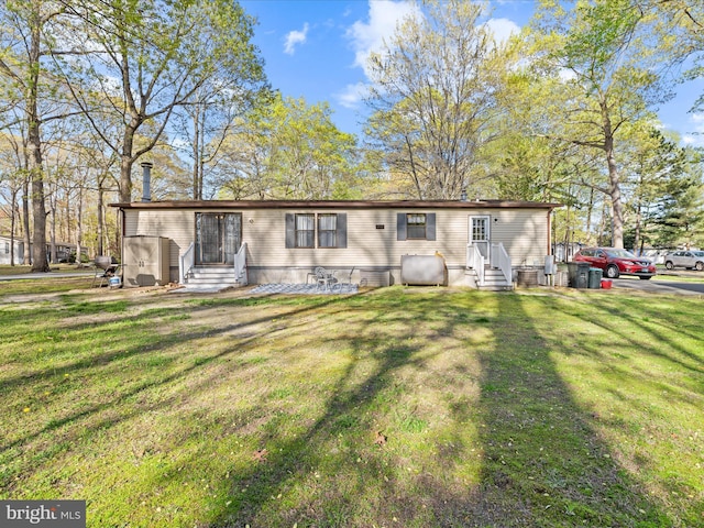 27689 Hartford Ct, Millsboro, DE 19966 - manufactured / mobile home with a front yard, entry steps, and heating fuel