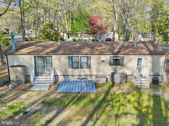 27689 Hartford Ct, Millsboro, DE 19966 - back of property with a lawn, crawl space, and entry steps