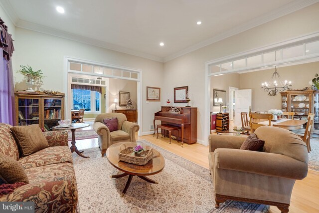 34844 Apple Pride Ct, Round Hill, VA 20141 - living room with a chandelier, recessed lighting, crown molding, and light wood-style floors