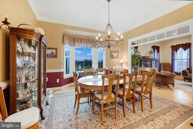 34844 Apple Pride Ct, Round Hill, VA 20141 - dining space featuring an inviting chandelier, ornamental molding, baseboards, and wood finished floors