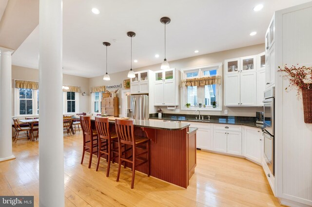 34844 Apple Pride Ct, Round Hill, VA 20141 - kitchen with appliances with stainless steel finishes, light wood-style flooring, and a healthy amount of sunlight