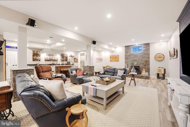 34844 Apple Pride Ct, Round Hill, VA 20141 - living area featuring a stone fireplace, recessed lighting, light wood-type flooring, and indoor wet bar