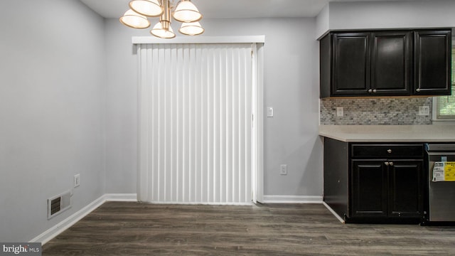 11400 Cosca Park Pl, Clinton, MD 20735 - unfurnished dining area featuring dark wood-type flooring, baseboards, a notable chandelier, and visible vents